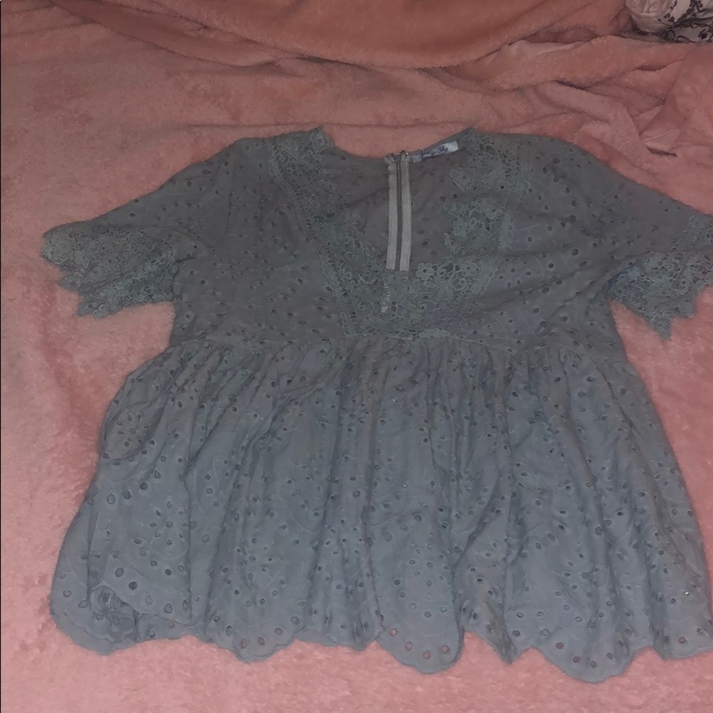 Blue lace top zips up in the back never worn